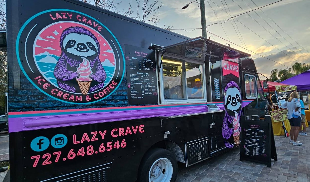 The Lazy Crave ice cream and coffee truck serving customers at an event